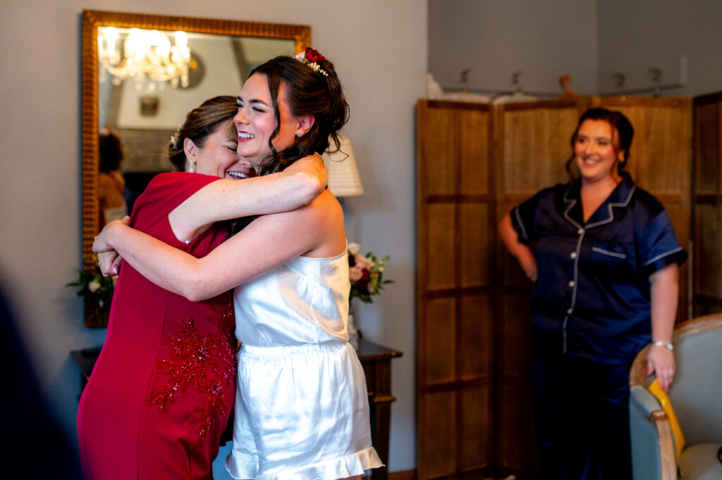 bride and her mom hugging
