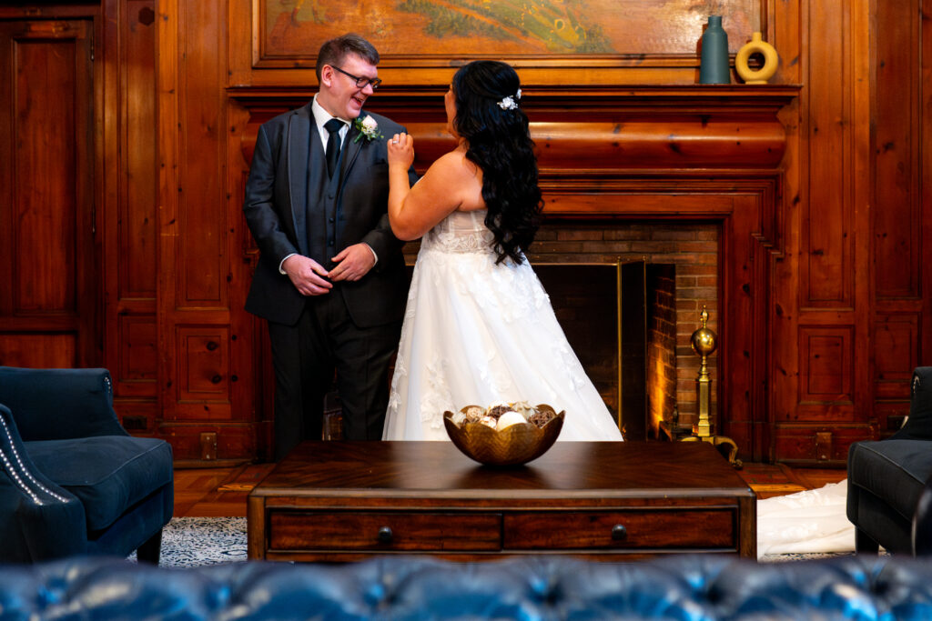 bride and groom smiling at each other