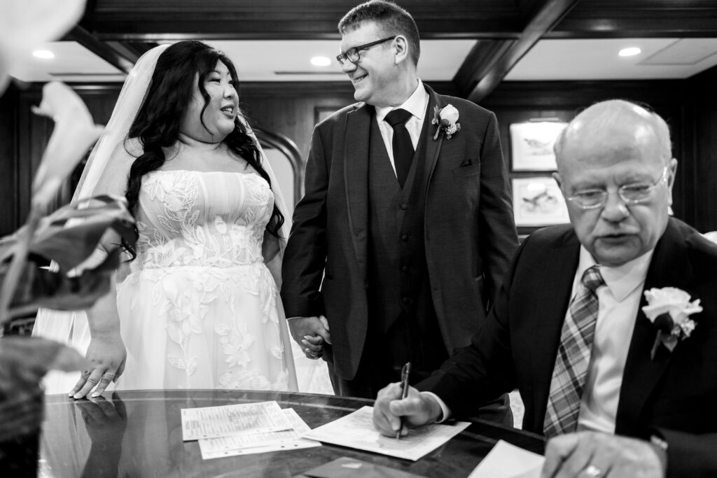 bride and groom looking and smiling at each other