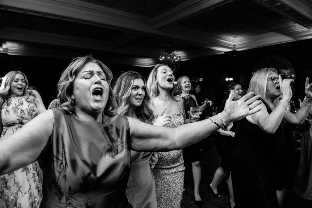 people singing on a dance floor