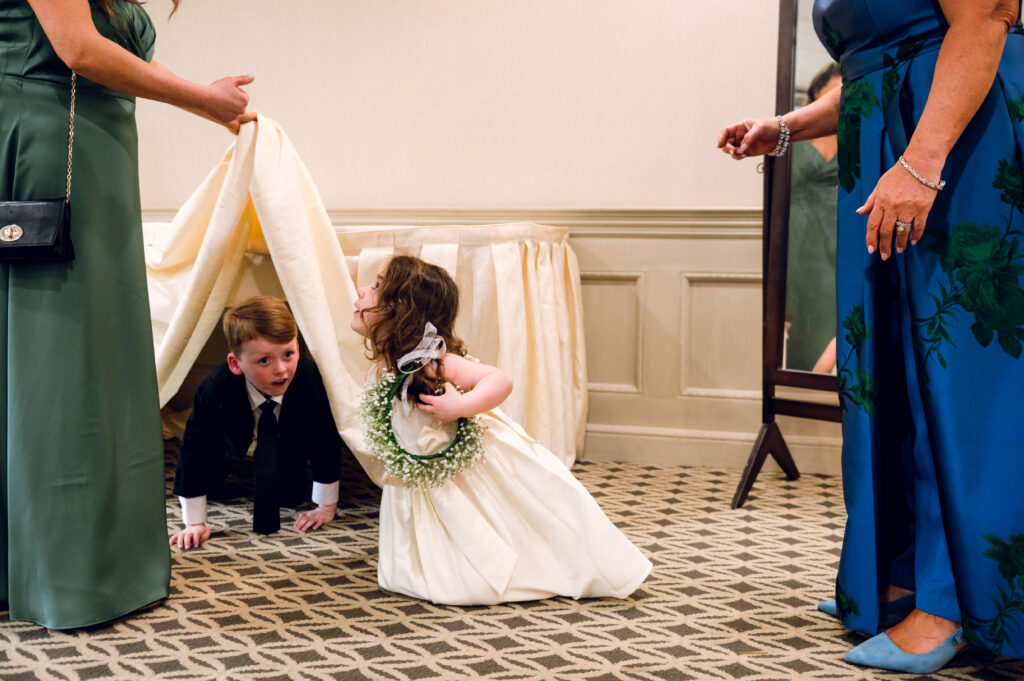flower girl playing on the ground