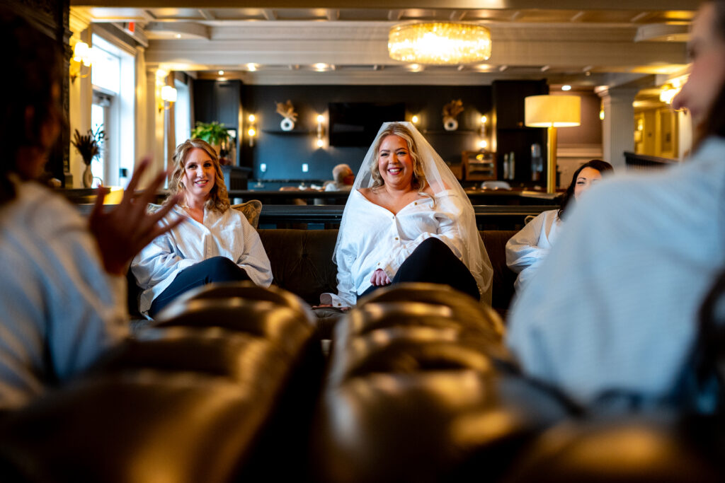 bride laughing with bridesmaids