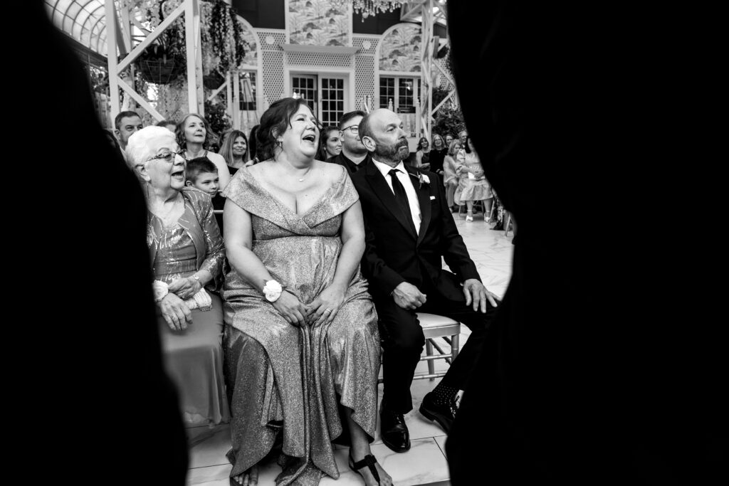 parents laughing during a ceremony