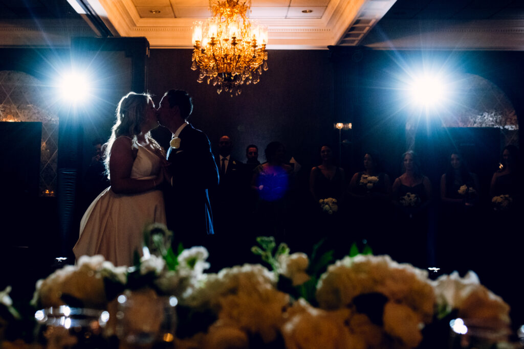 bride and groom kissing on the dance floor